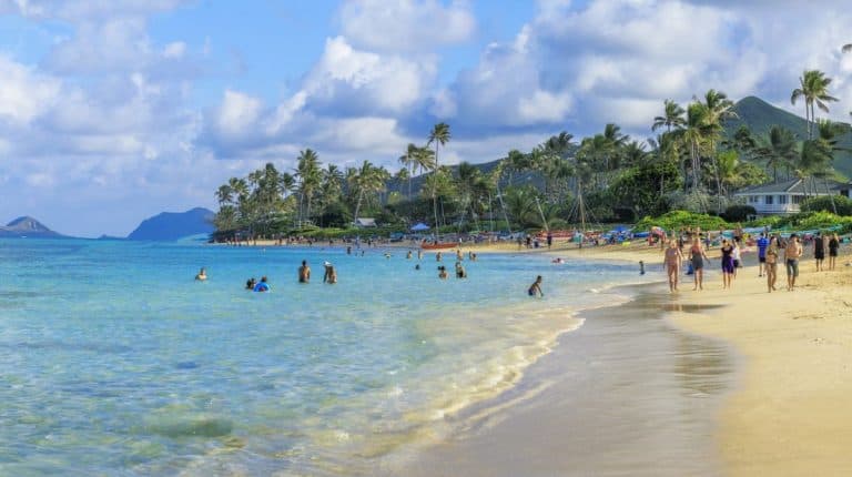 People on Lanikai Beach Oahu in the sunshine