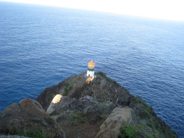 Makapu'u Lighthouse from the trail, surrounded by the blue Pacific